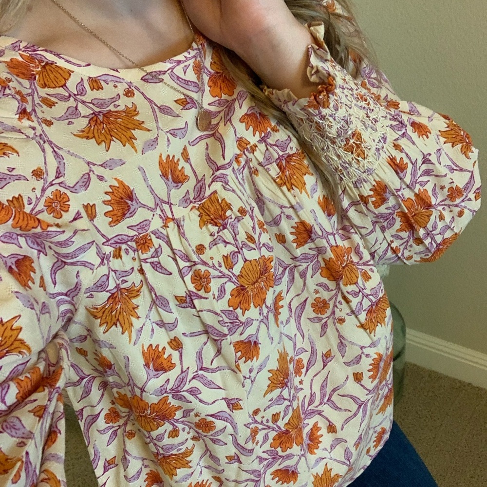 Cream top with orange and lilac floral detail